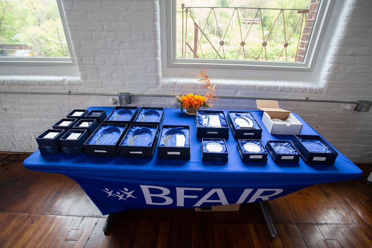 A table with glass awards at the BFAIR Annual Meeting