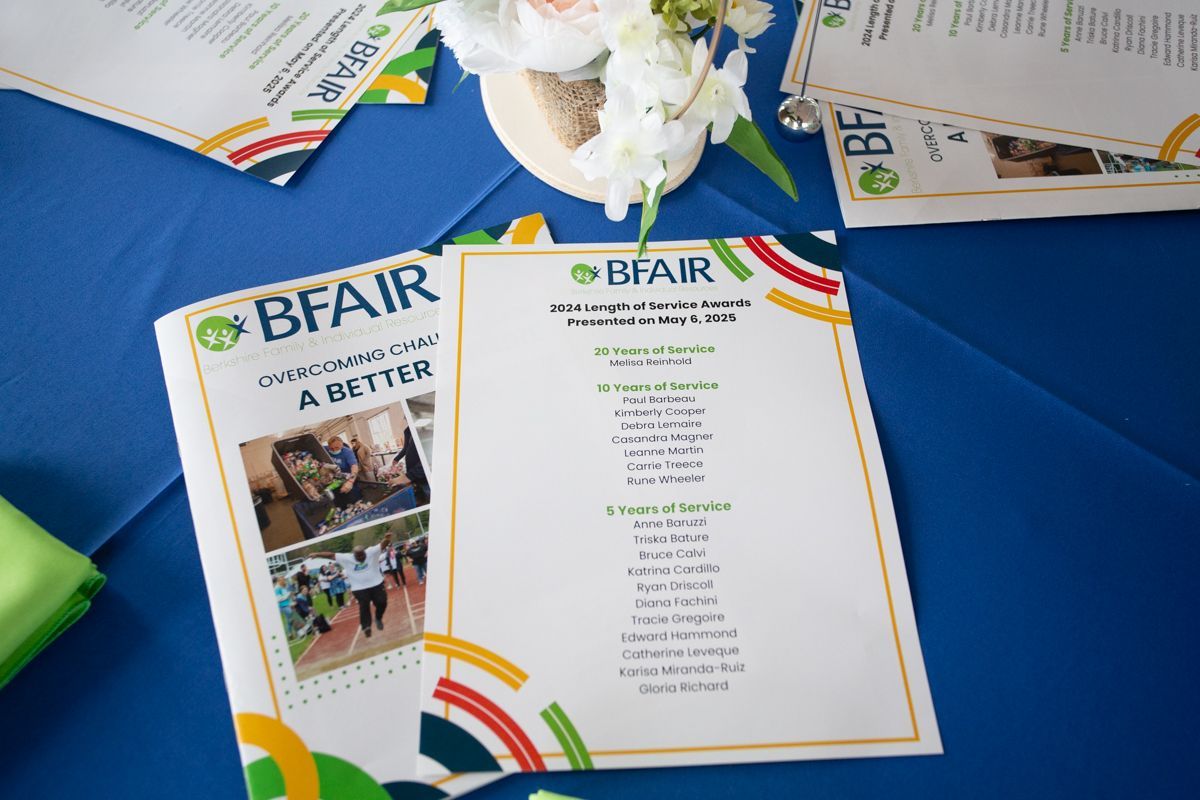 Brochures on a table at the BFAIR Annual Meeting