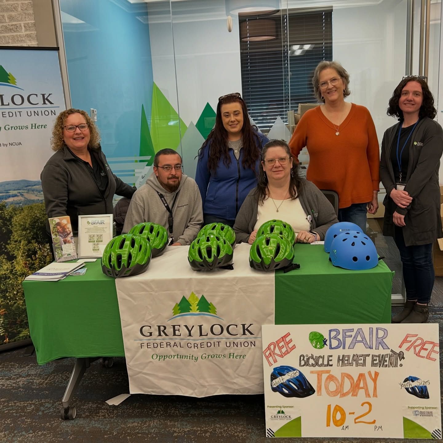 BFAIR & GFCU Staff hand out free bicycle helmets at the Greylock Allendale location in Pittsfield