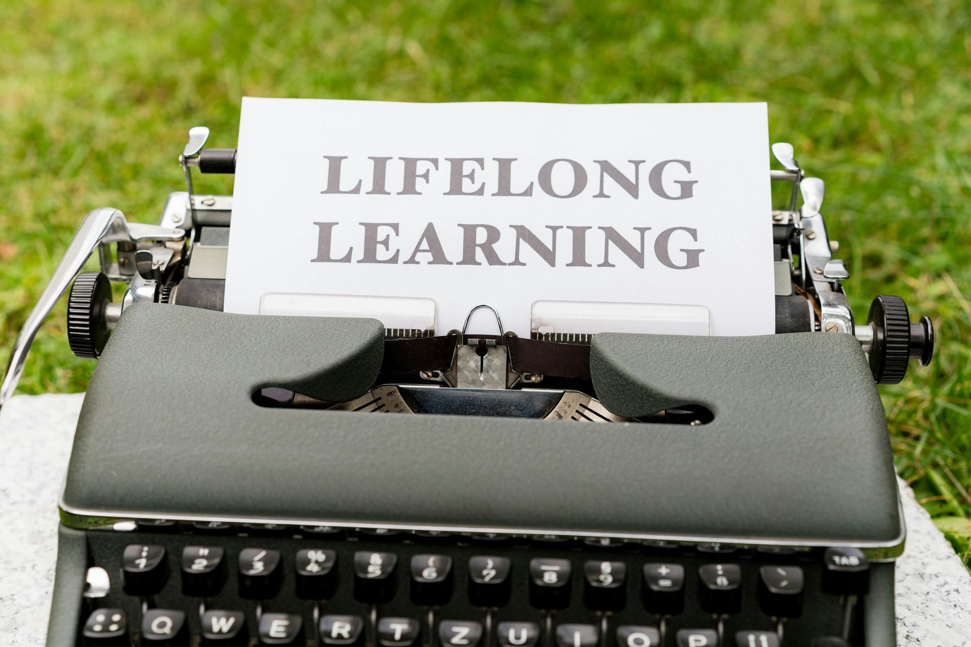 Lifelong Learning paper coming out of a typewriter