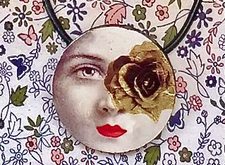 A round pendant featuring a black-and-white face with a gold rose over one eye and bright red lips, set against floral art.