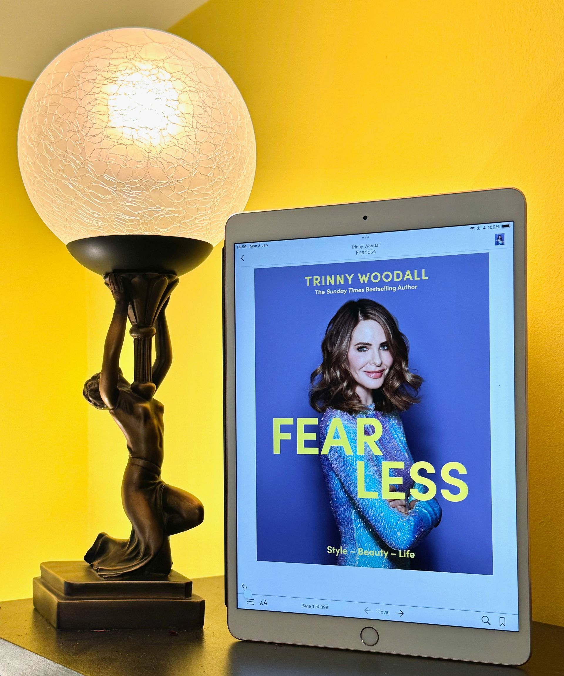 A tablet displaying a book cover titled 