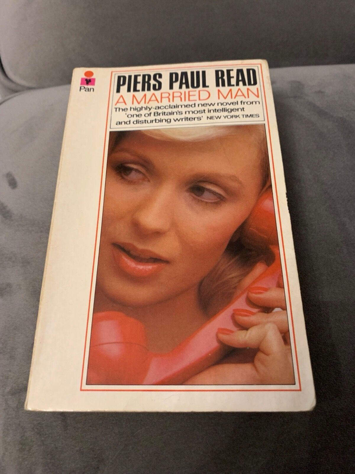 Book cover of *A Married Man* by Piers Paul Read, showing a close-up of a woman on a red phone.
