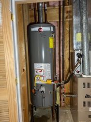 Water Heater Tank in corner of basement