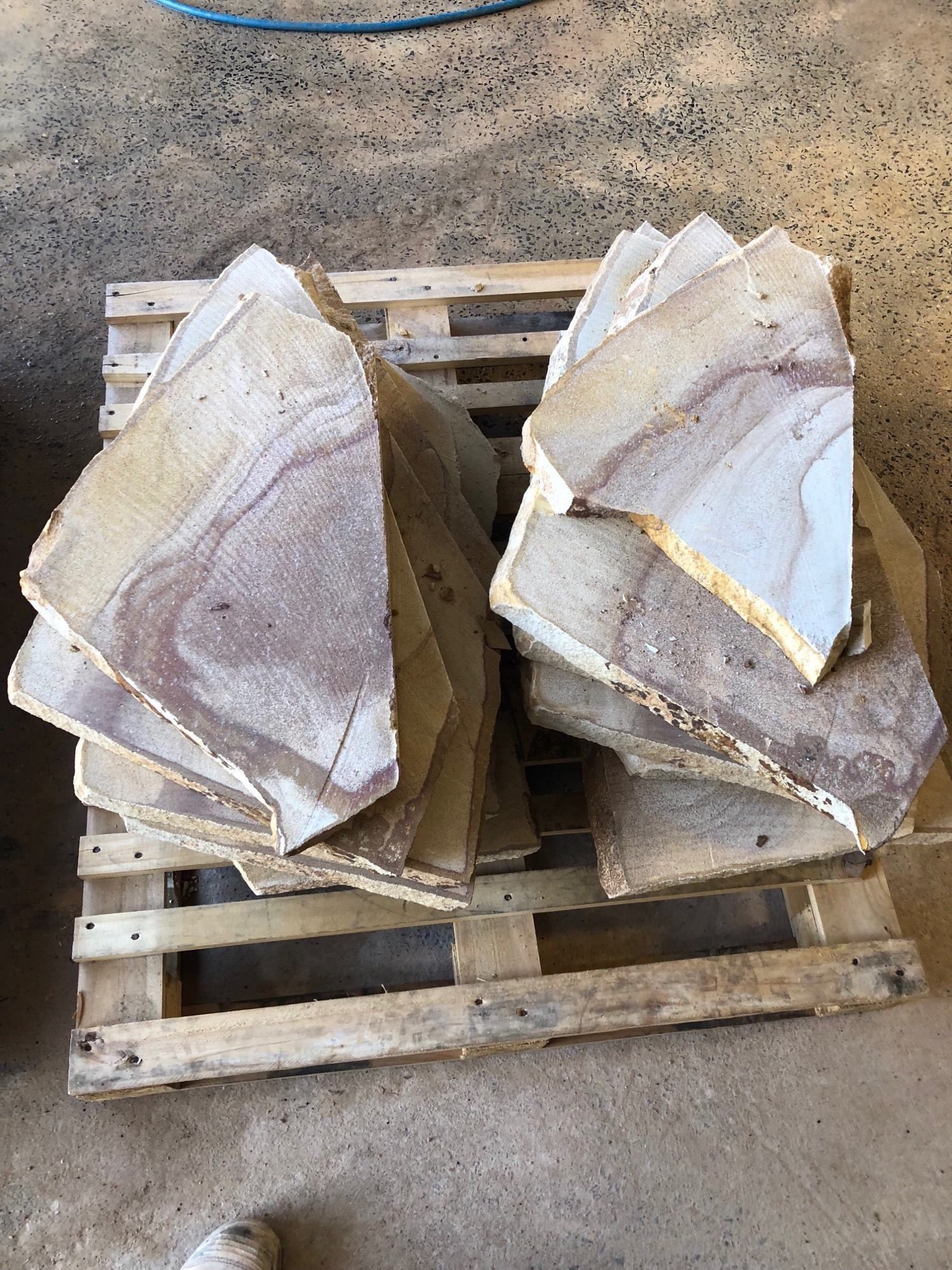 Stack of Sandstone Flagstones on a Wooden Pallet — Australian Sandstone Products In Helidon, QLD
