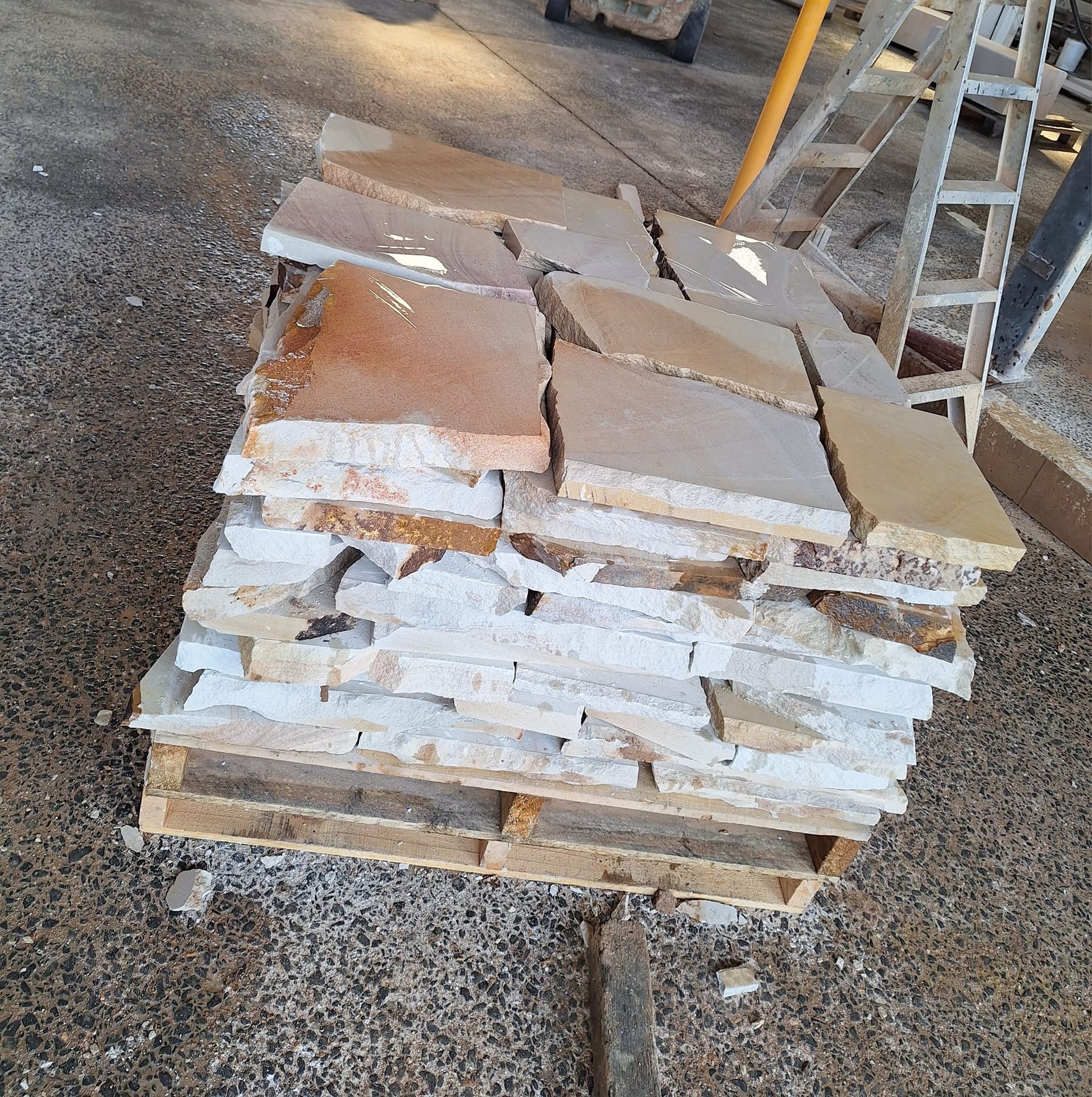 a Pallet of Assorted Stone Tiles, Varying Colors of Beige and Tan — Australian Sandstone Products In Gatton, QLD