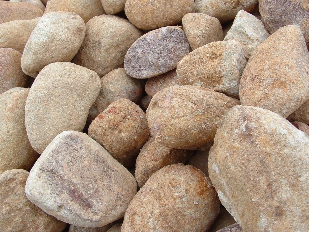 Close-up of a Pile of Rounded, Tan River Rocks — Australian Sandstone Products In Helidon, QLD