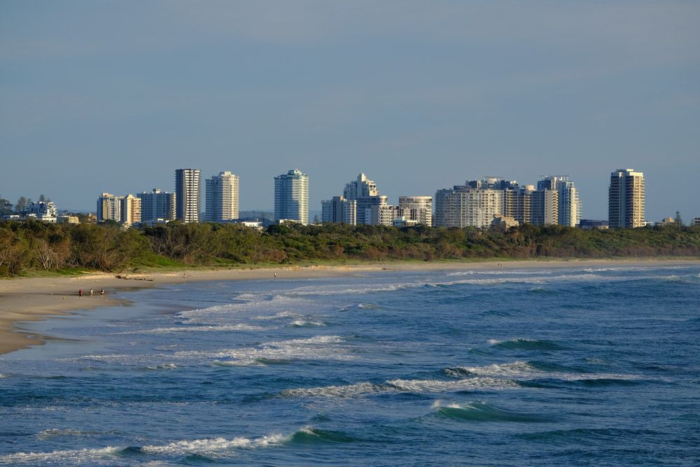 A Beach With A City Skyline In The Background — Australian Sandstone Products In Tweed Heads, QLD