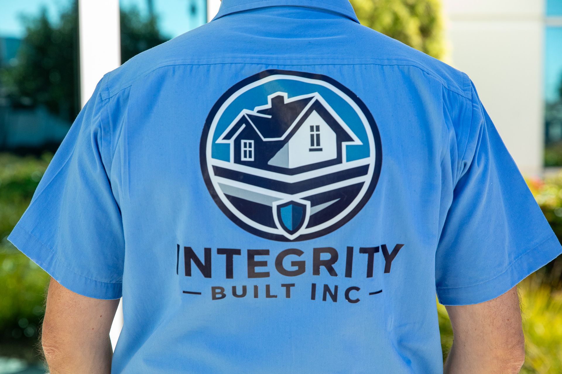 Person wearing a light blue shirt with 