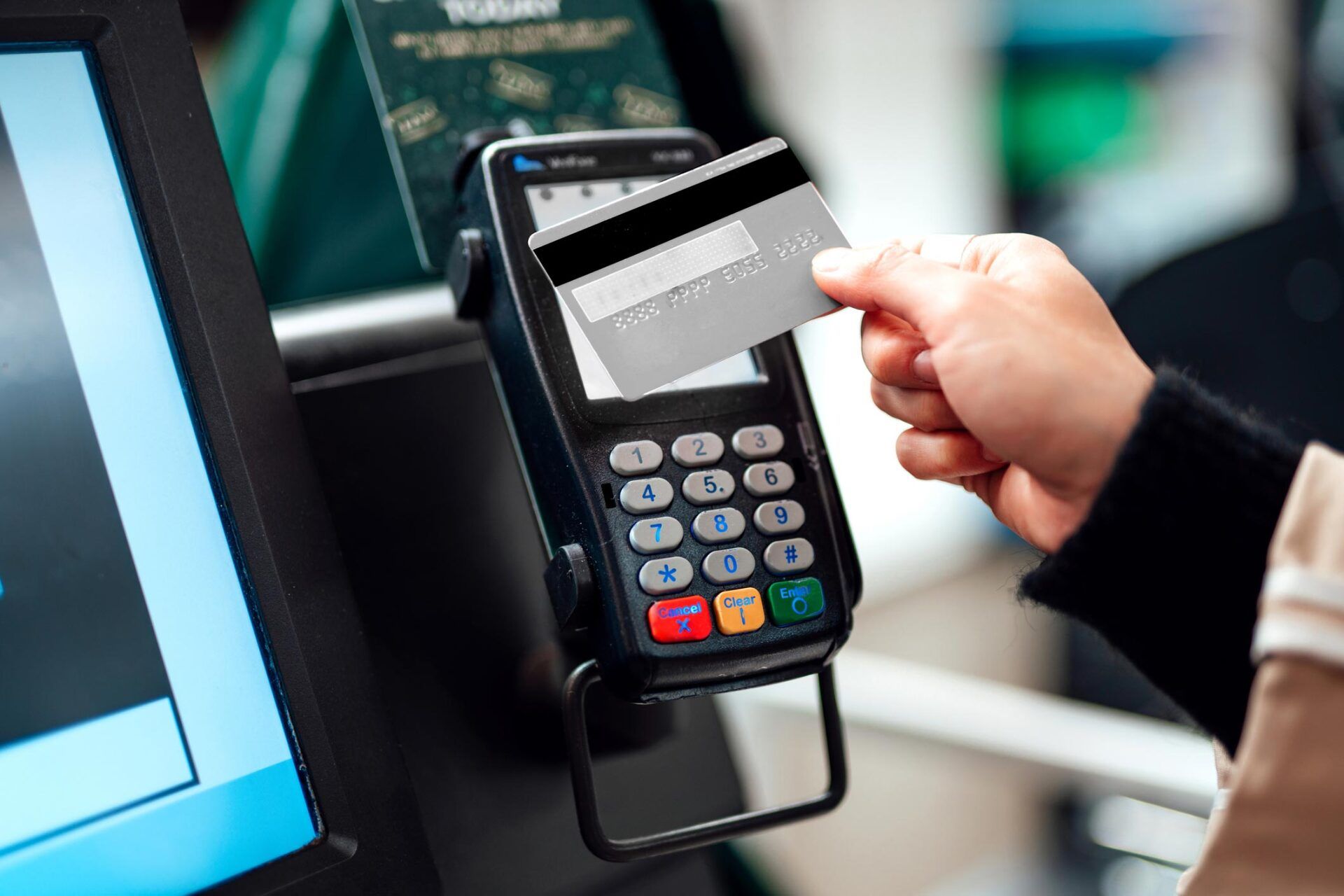 Woman Using Credit Card — Brentwood, TN — Shield Law Group