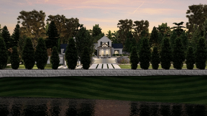 White house behind a row of tall trees, with a manicured lawn and lake in the foreground at sunset.