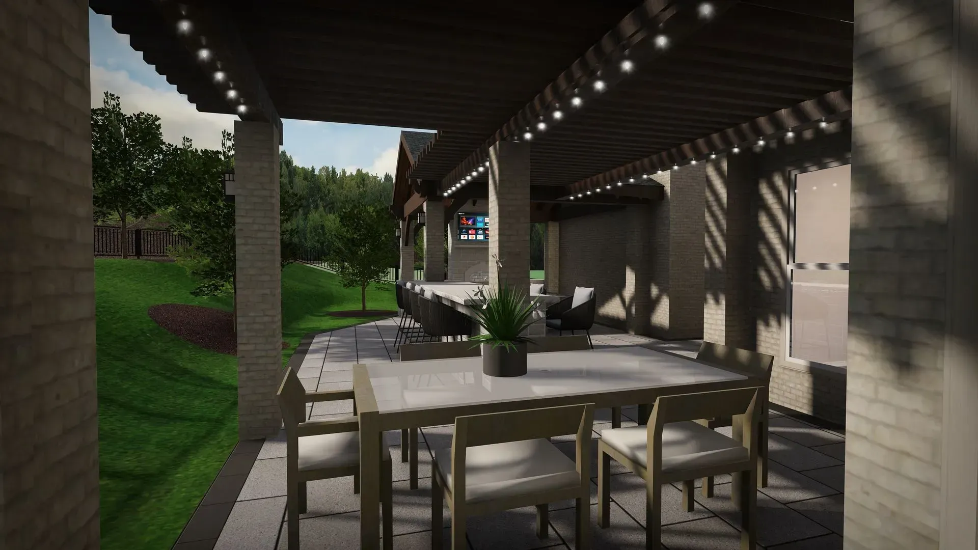 Covered patio with a dining table and chairs beside a house, overlooking a grassy yard.