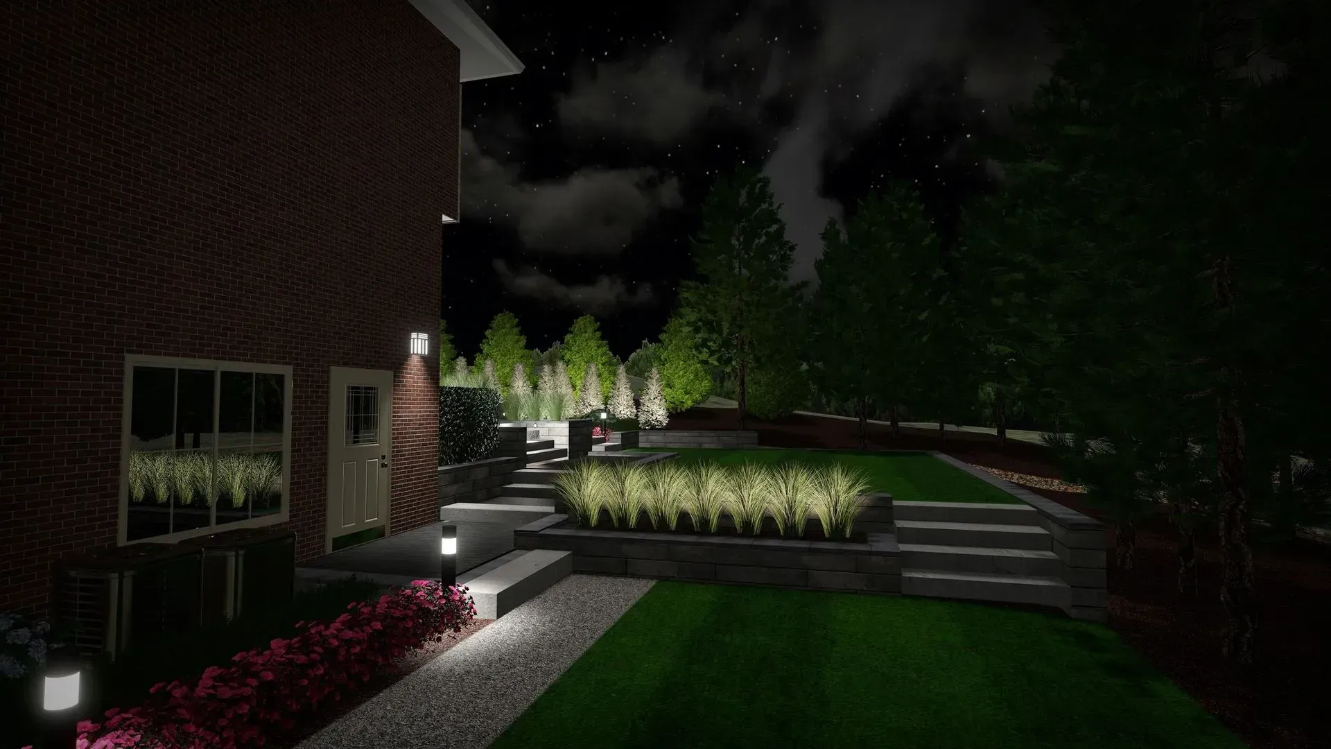 Lit landscaped garden at night beside a brick building, with path lights, shrubs, and trees.
