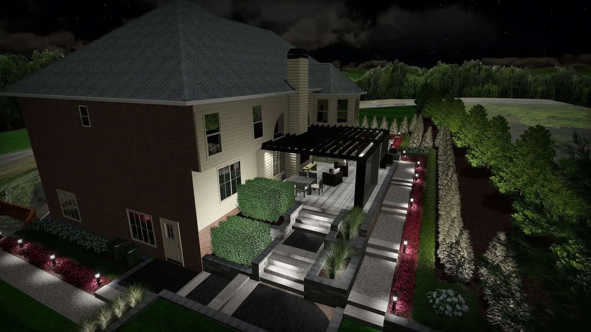Nighttime exterior of a large house with lit walkways, hedges, and a patio pergola