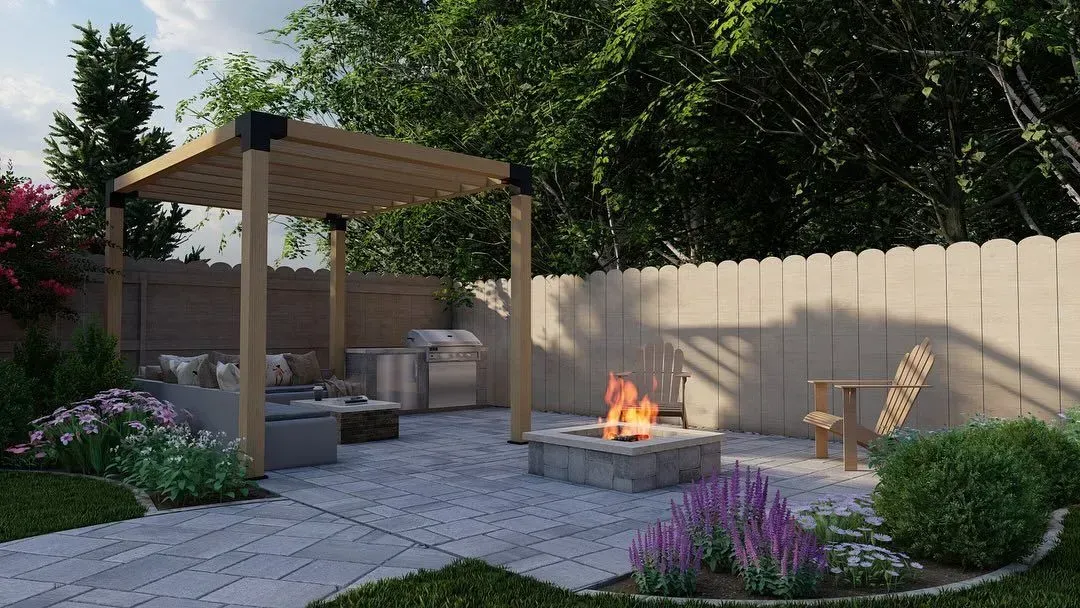 Backyard patio with pergola, outdoor seating, fire pit, and purple flowers at dusk