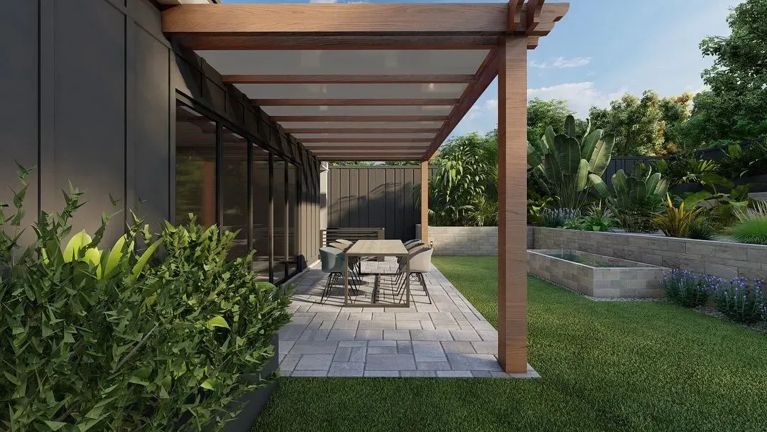 Covered patio with outdoor dining table, wood pergola, and garden view