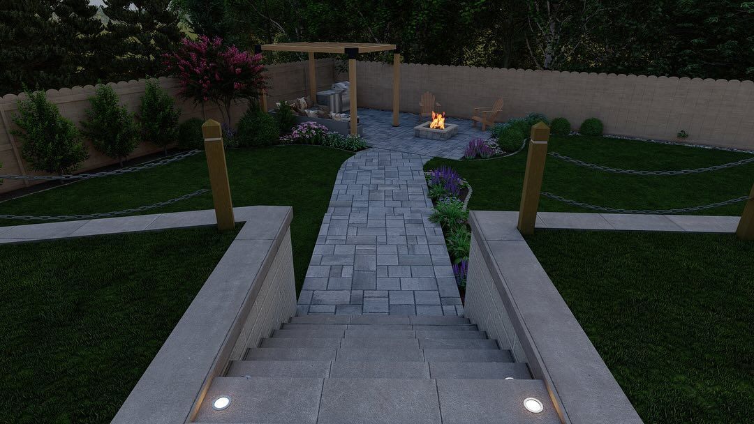 Stone steps leading to a landscaped backyard path with lit posts, green lawn, and a small fire pit at dusk