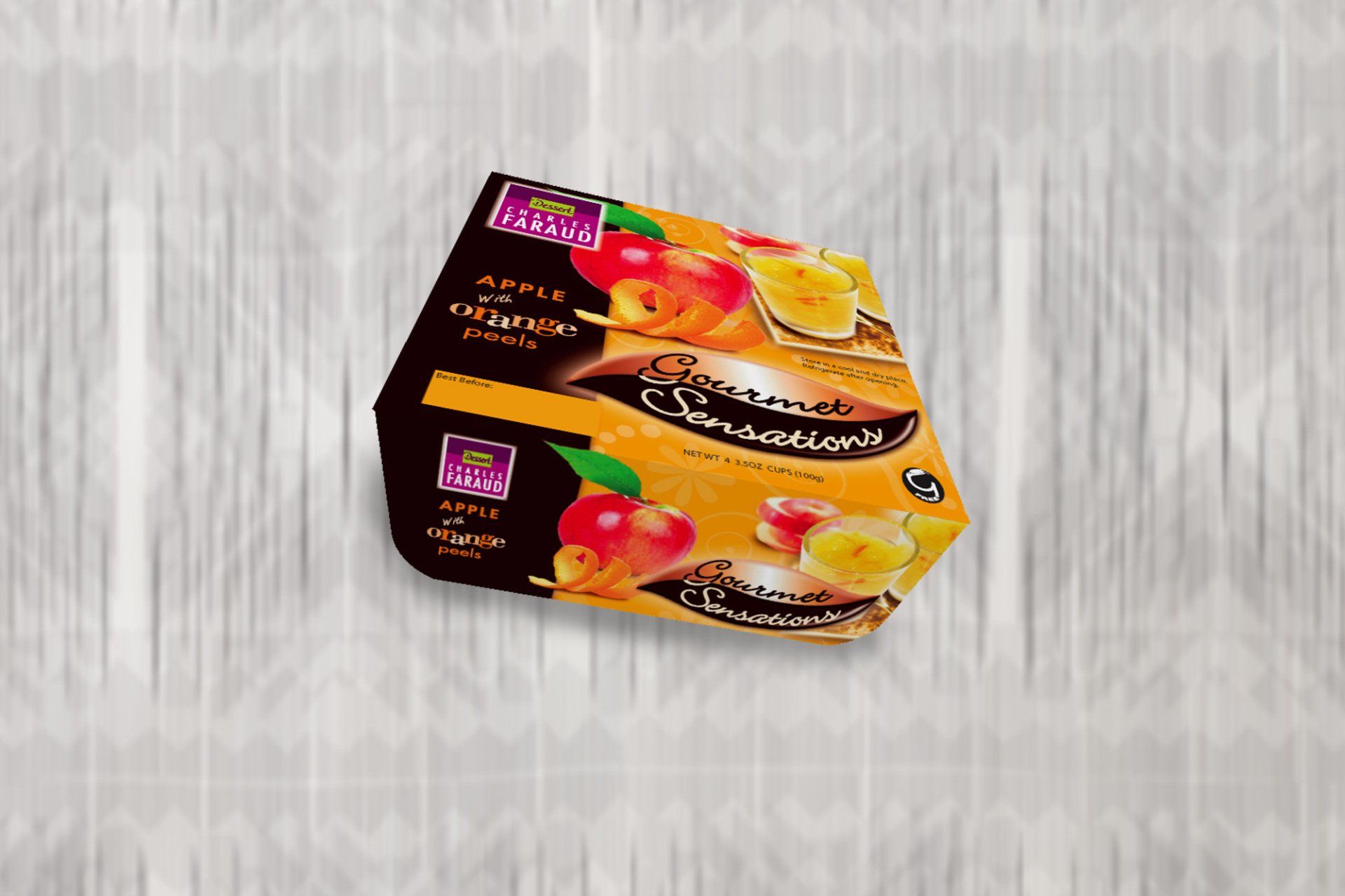 Package of fruit-flavored, frozen snacks with apple and orange illustrations on a blurred background.