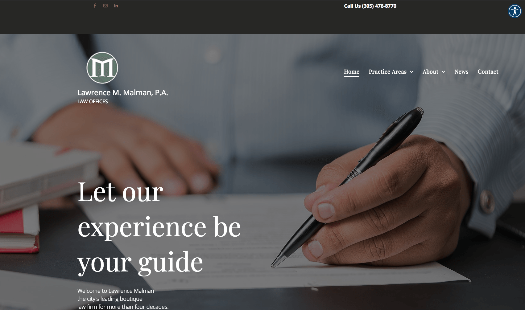 Website homepage with a person's hand writing with a pen on paper, and the text 