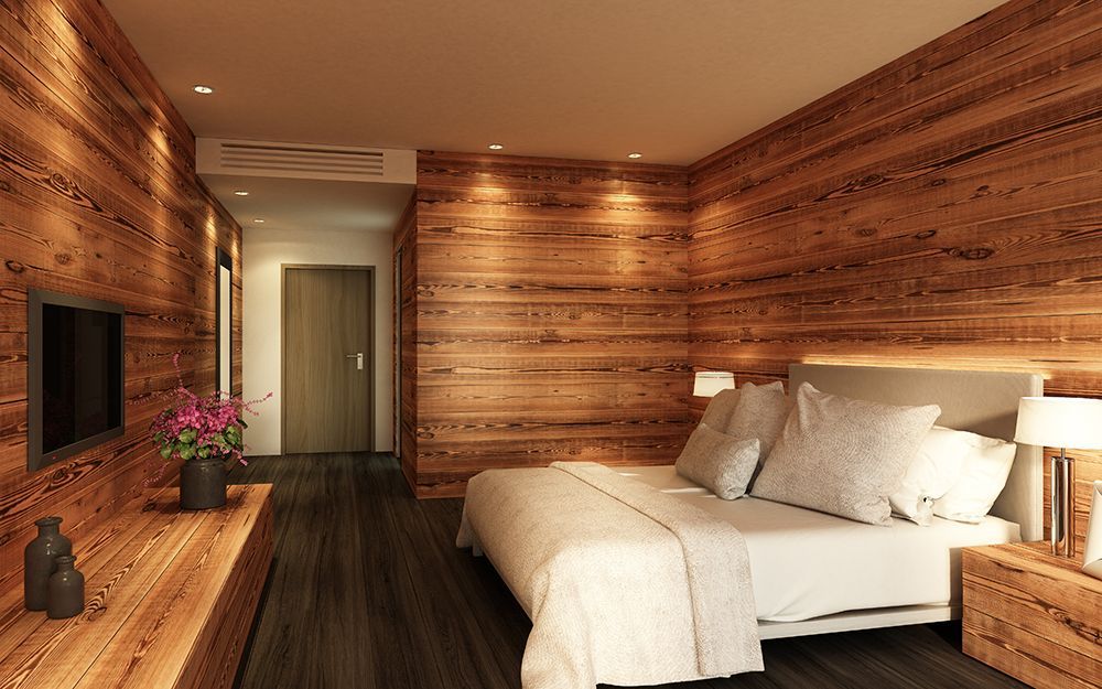 Ein modernes Schlafzimmer mit holzgetäfelten Wänden