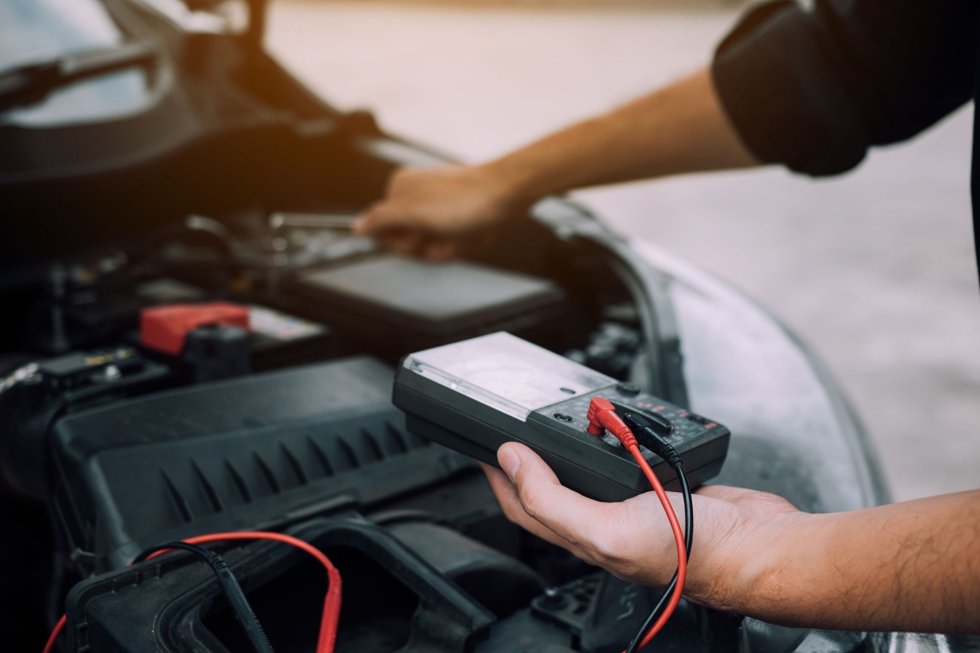 Nathan Channells working on a vehicle's electrical harness in the Atherton workshop