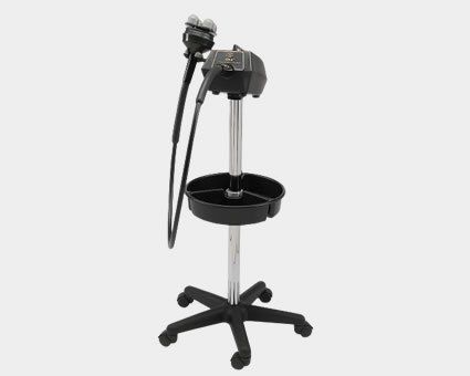 Black salon hair steamer on a wheeled stand, with a tray and a flexible hose with nozzle.