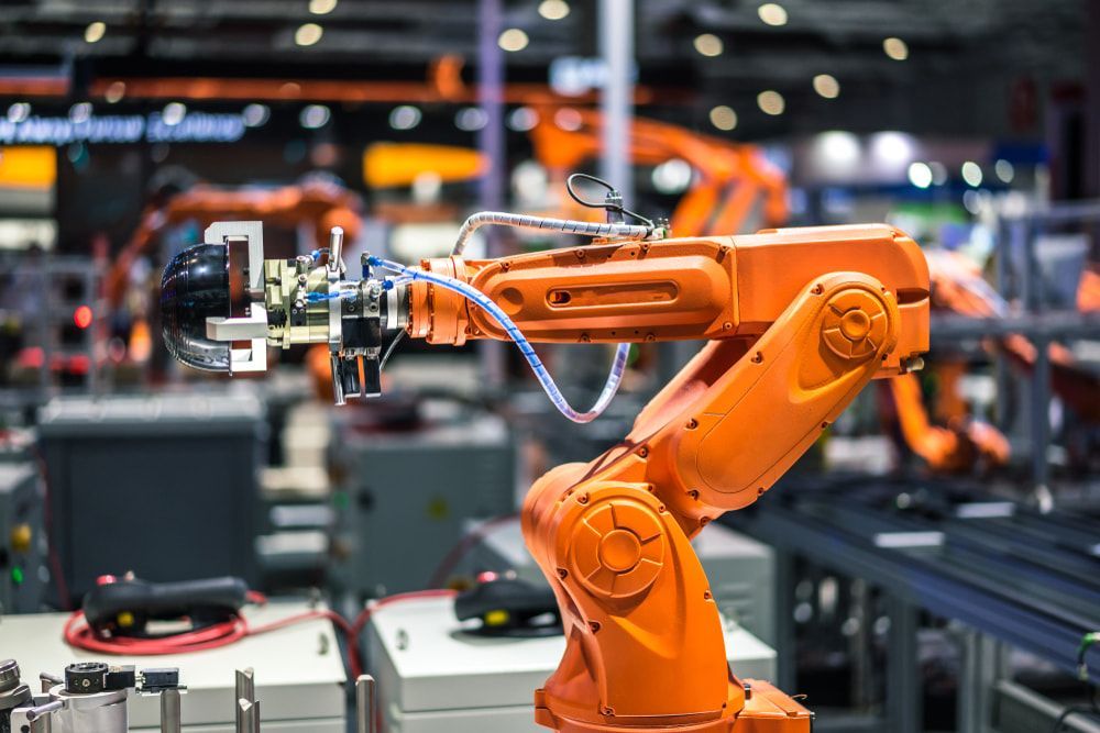 A Robotic Arm Is Sitting On Top Of A Table In A Factory — In Electrics In Tully, QLD