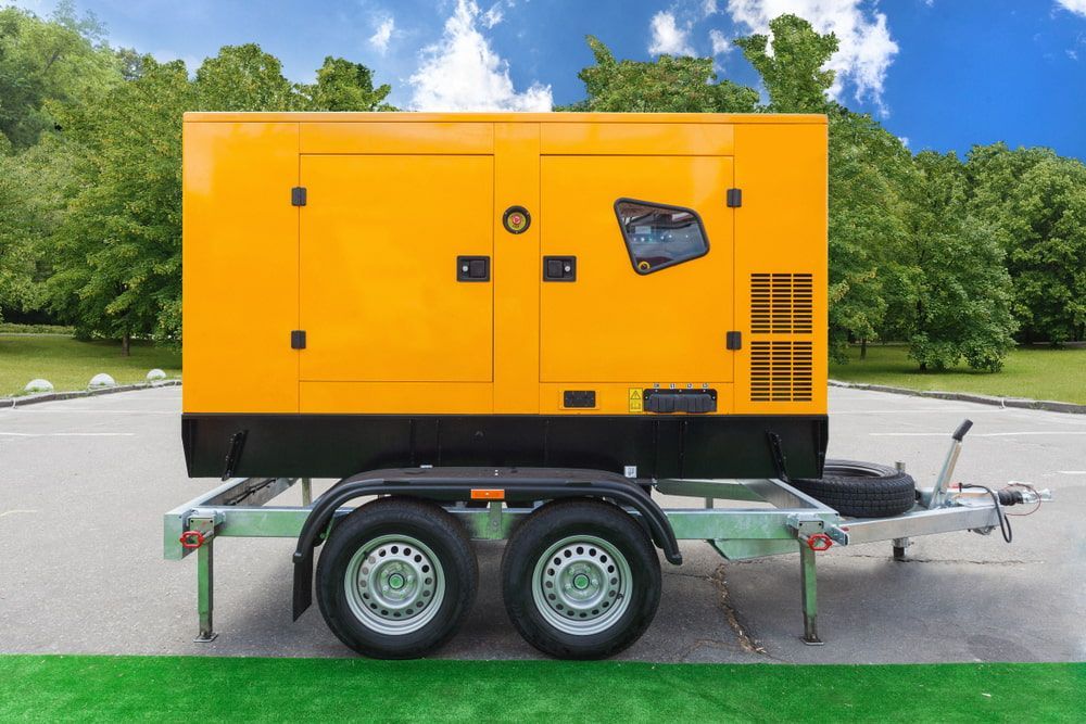 A Yellow Generator Is On A Trailer In A Park — In Electrics In Babinda, QLD