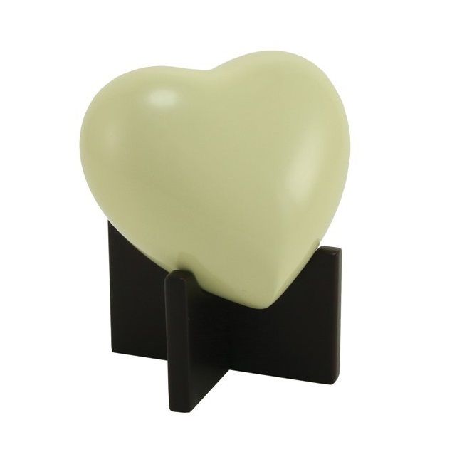 Cream heart-shaped ornament on a black stand