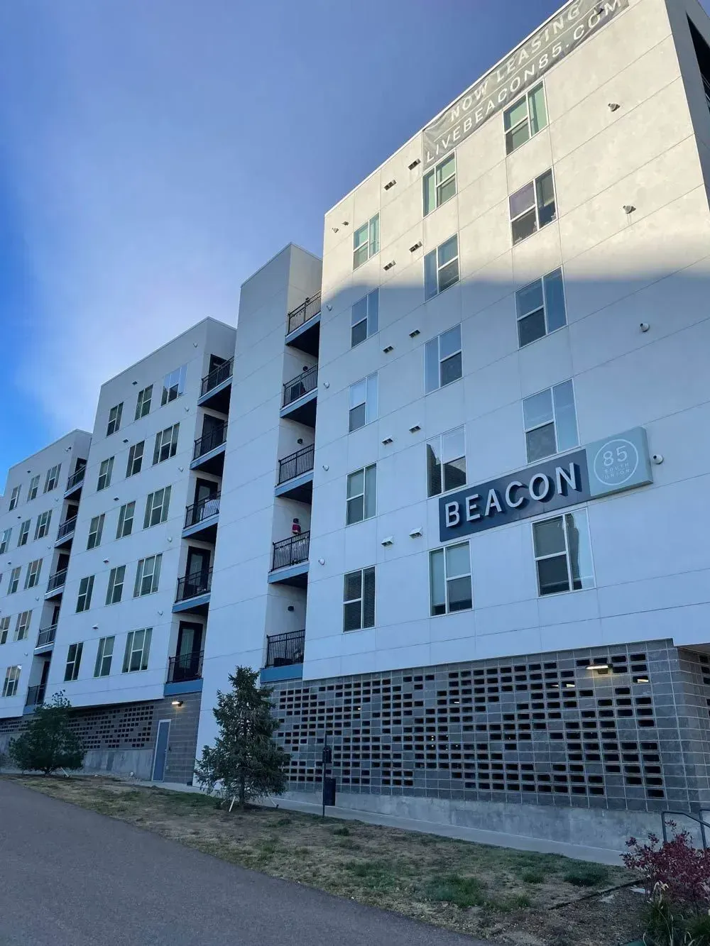 Modern white apartment building with the word