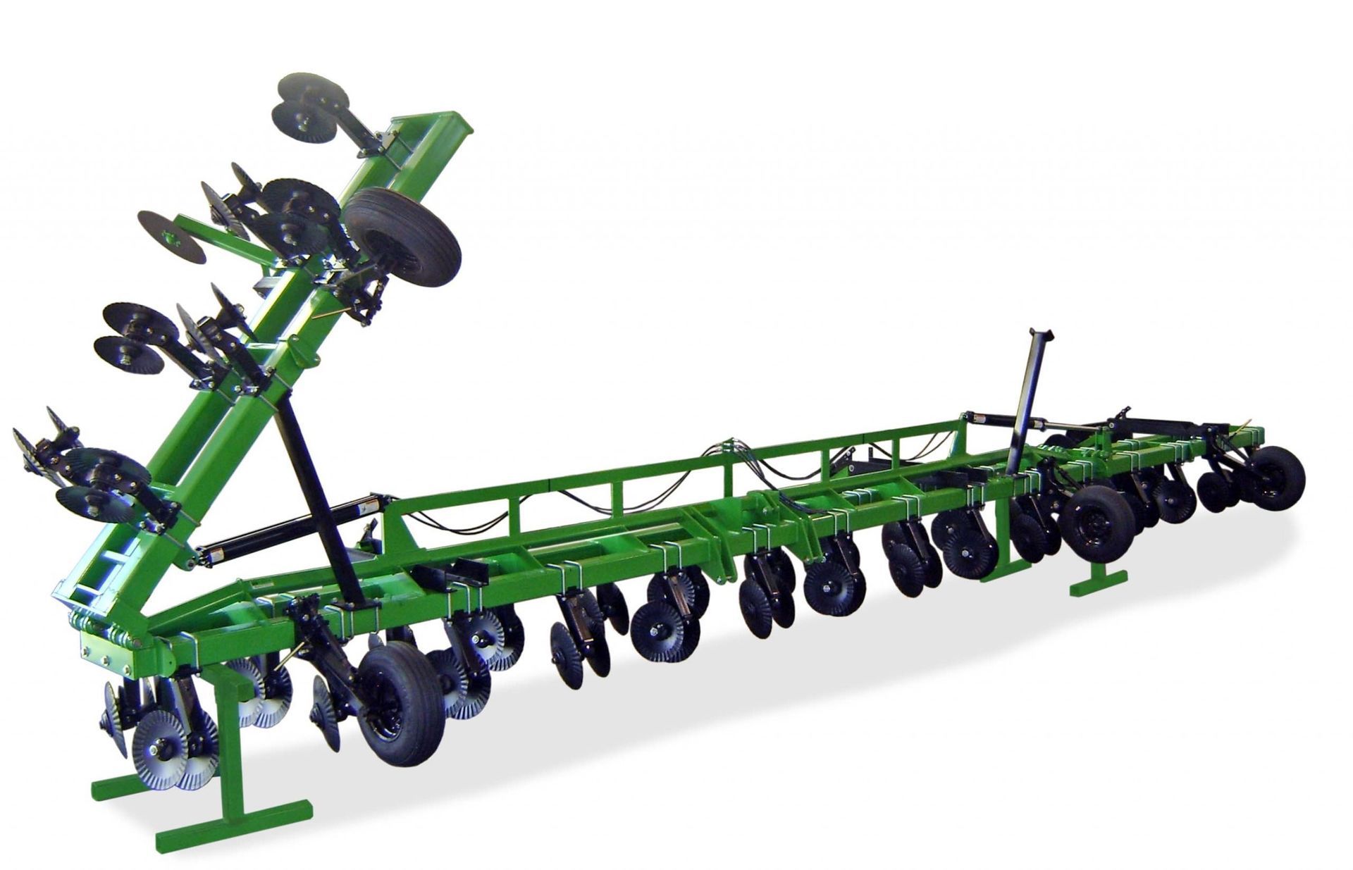 A green tractor with black wheels is sitting on a white surface.