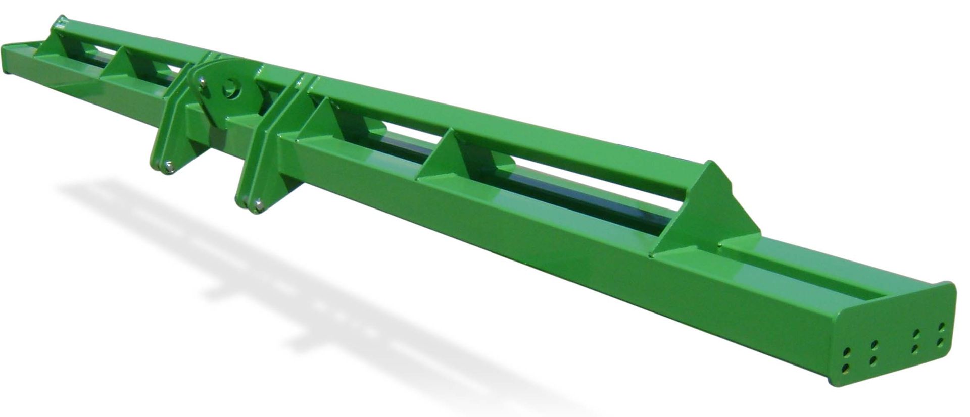A green metal object is sitting on a white surface.