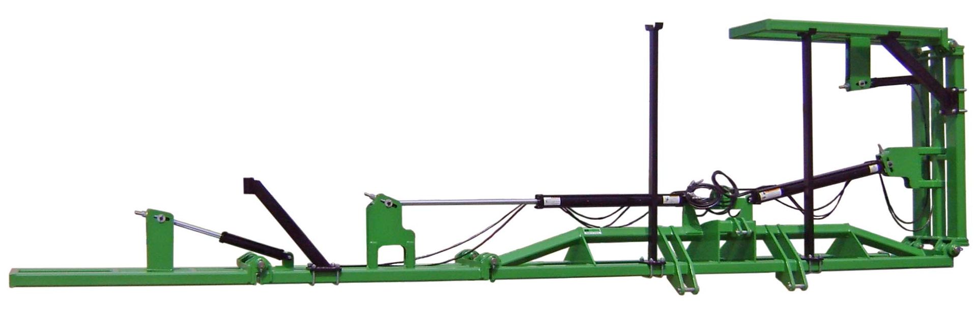 A green machine is sitting on a white surface.