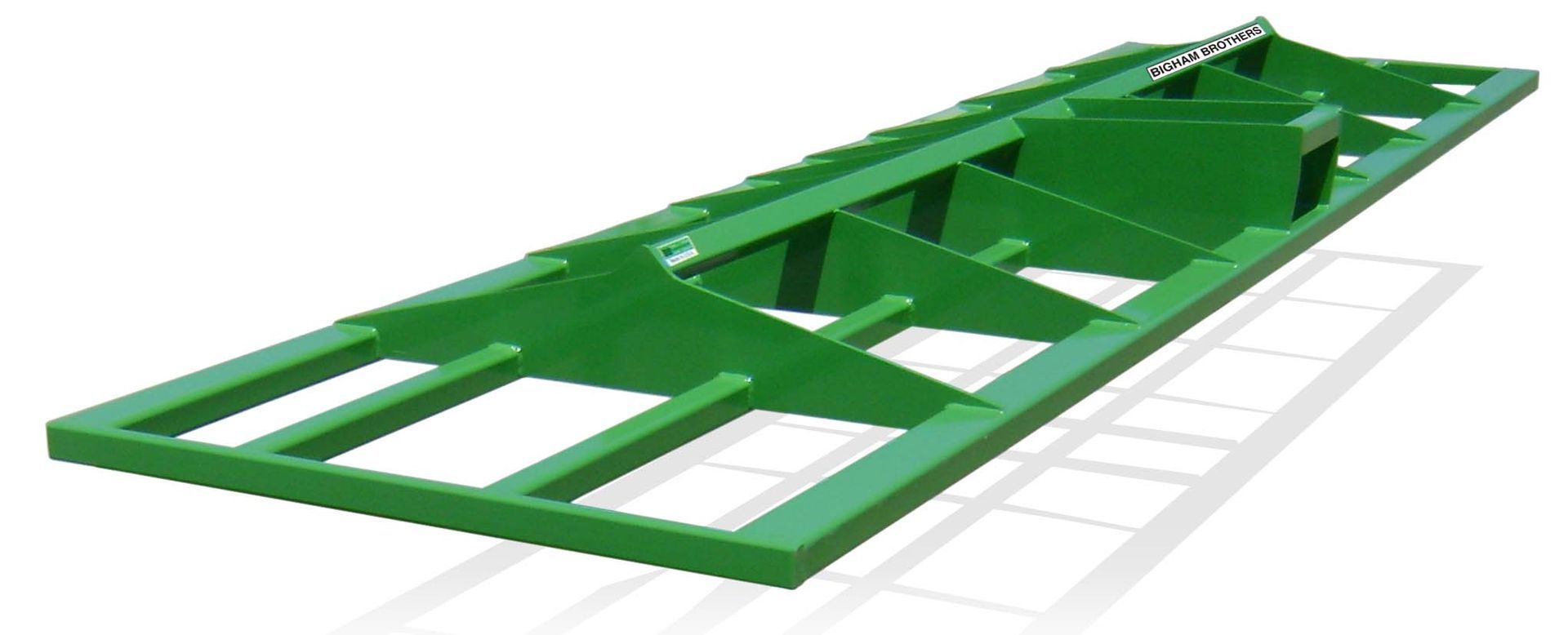 A green metal frame is sitting on a white surface.