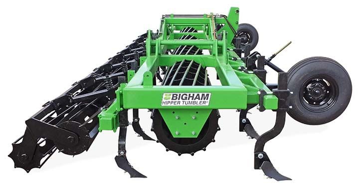 A green and black machine is sitting on a white surface.
