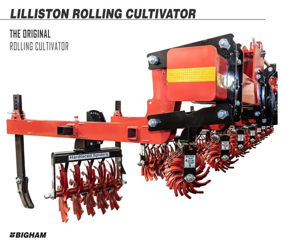 A picture of a lilliston rolling cultivator on a white background