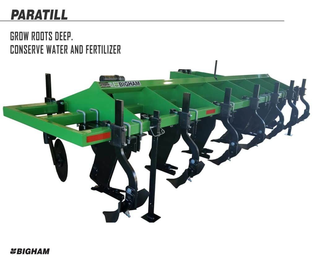 A green and black plow that says paratill grow roots deep conserve water and fertilizer