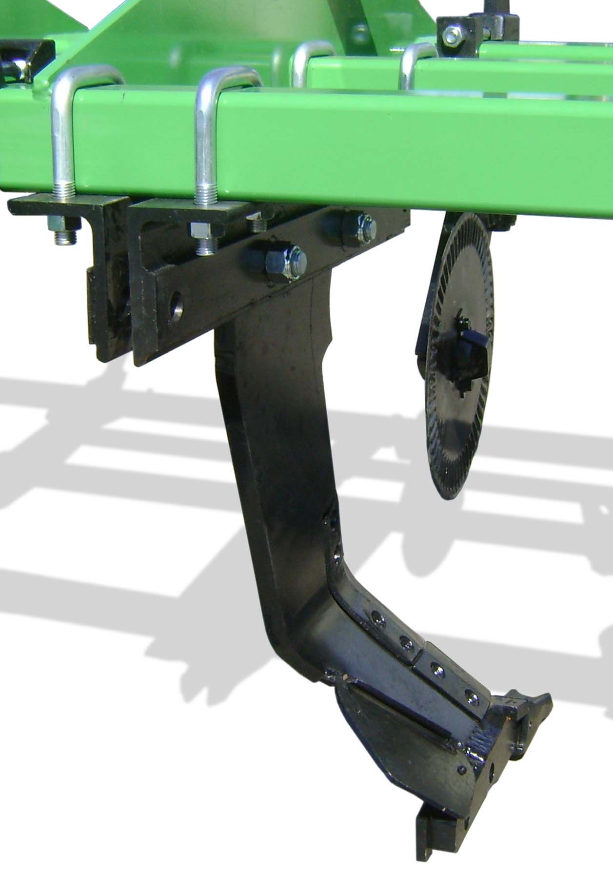 A close up of a green and black tractor on a white background