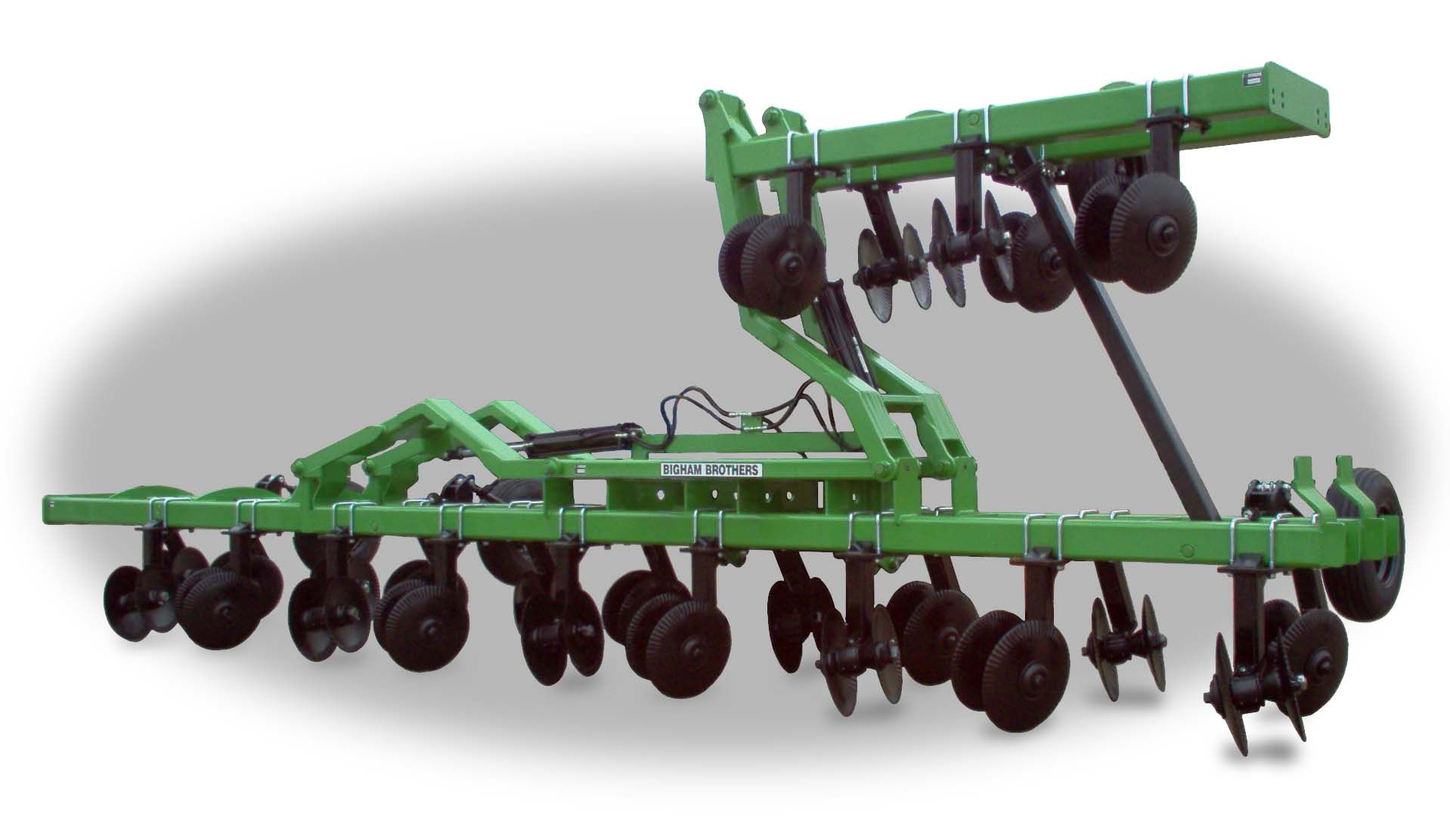 A green tractor with a bunch of wheels on it