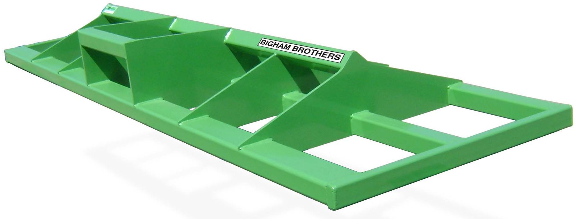 A green metal item is sitting on a white surface.