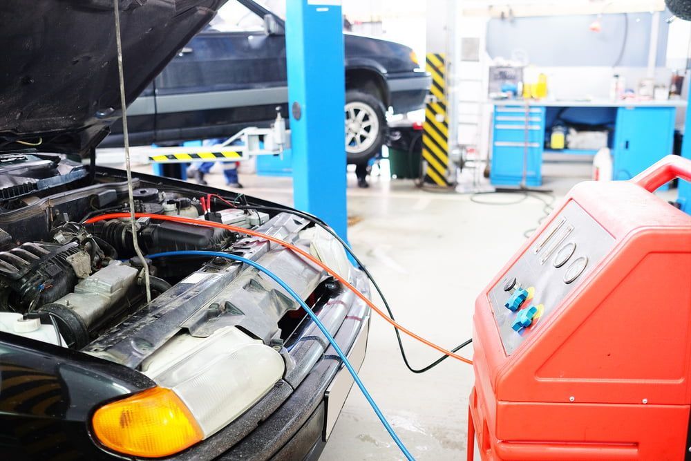 A Car is Being Serviced in a Garage With the Hood Open — Bittkau Auto Care in Maroochydore, QLD