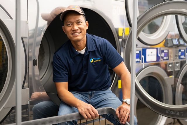 Cleo Quijano beside the laundry machines at Fresh Laundries in Fairfield, California