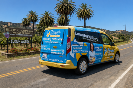 Fresh Laundries pickup and delivery van beside the Suisun Valley sign