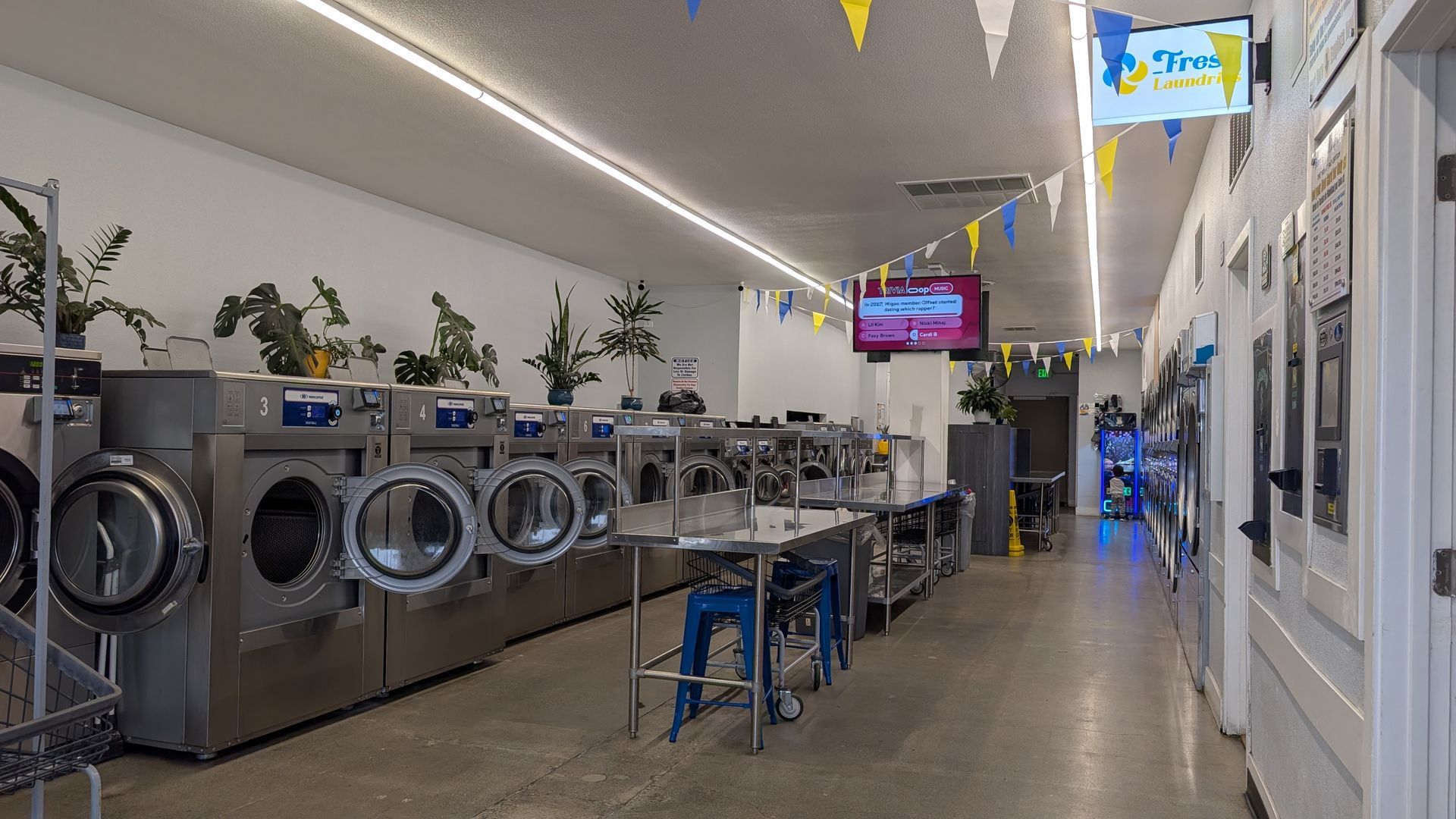Rows of modern washers inside Fresh Laundries in Fairfield
