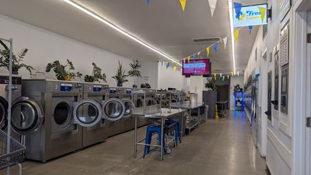 Rows of oversized washers inside Fresh Laundries