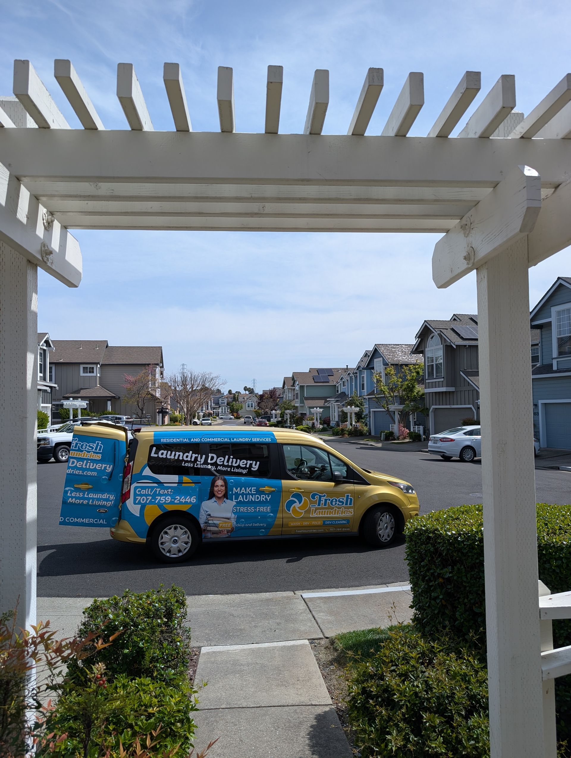 The Fresh Laundries van making a neighborhood pickup and delivery stop