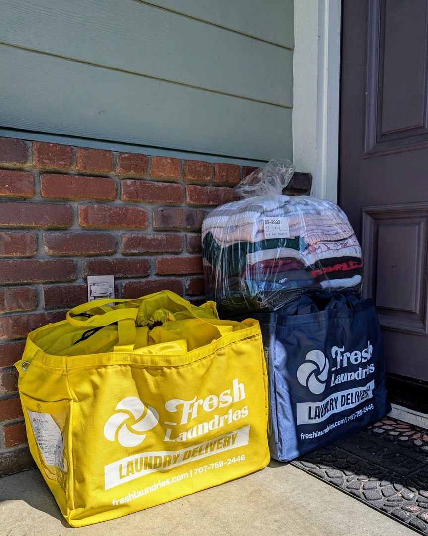 Fresh Laundries pickup and delivery bags ready at a customer's doorstep