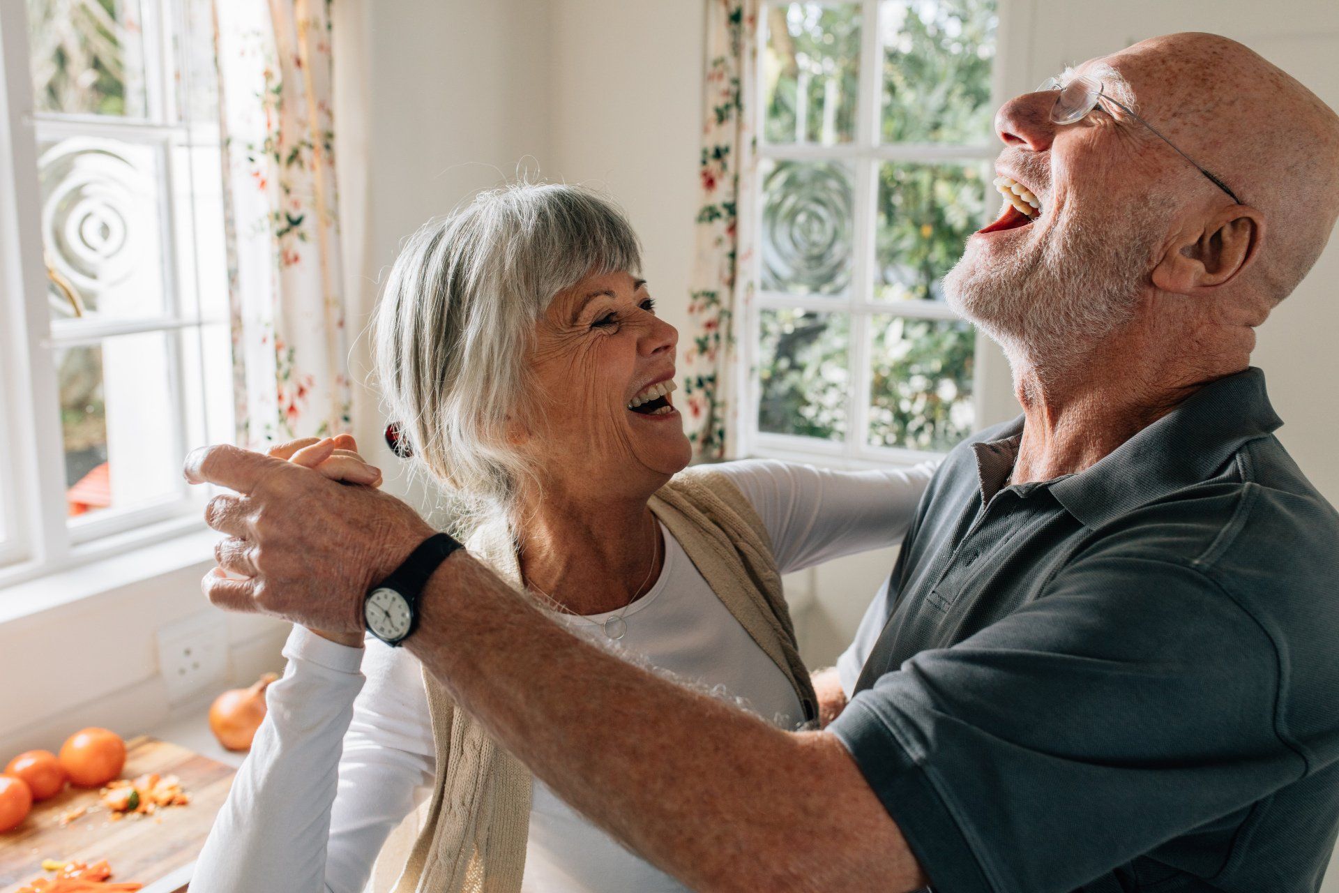 Senior Couple Laughing and Having Fun Dancing — Glenview, IL — Partners In Healthcare Senior Couple Laughing and Having Fun Dancing — Glenview, IL — Partners In Healthcare