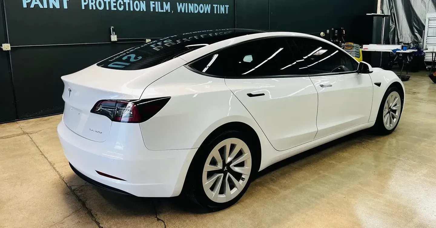 window tinting on red car