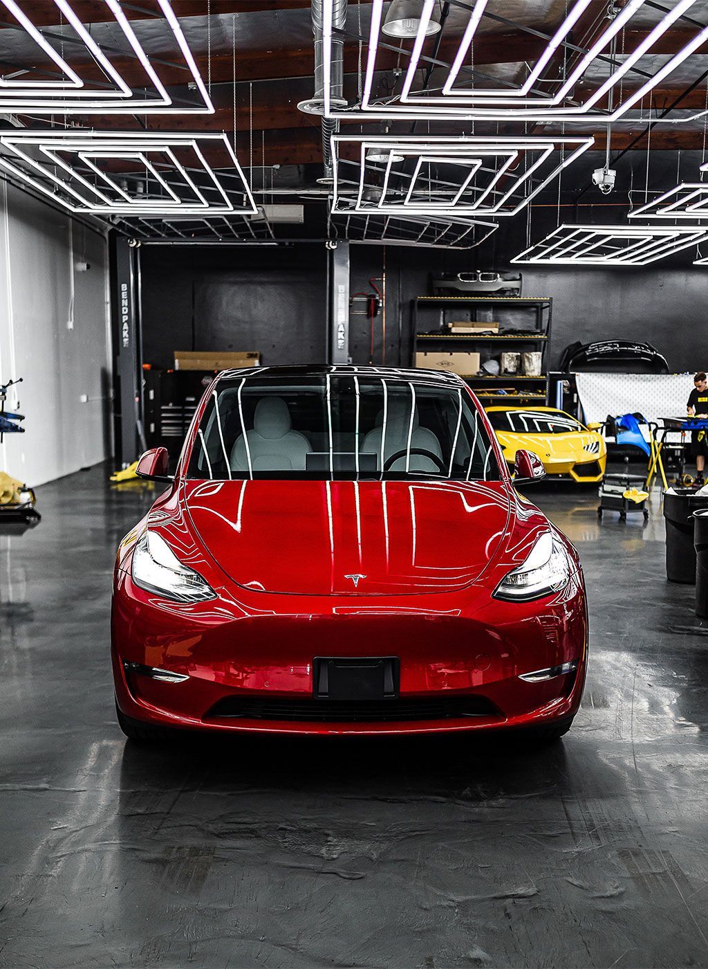 Ceramic coating on a red Tesla.
